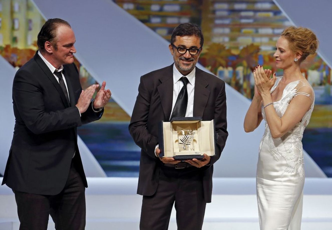 Nuri Bilge Ceylan, Cannes Film Festivali'nden 'Kış Uykusu' ile kazandığı ödülü Quentin Tarantino ile Uma Thurman'ın elinden aldı. 