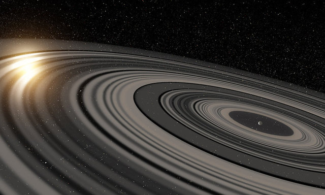 SATÜRN'ÜN AĞABABASI - Amerikalı astronomlar, uzayın derinliklerinde, Güneş Sistemi'nin 6 halkalı gezegeni Satürn'e çok benzeyen ancak halkaları Satürn'den 200 kat daha büyük olan bir yıldız keşfetti.