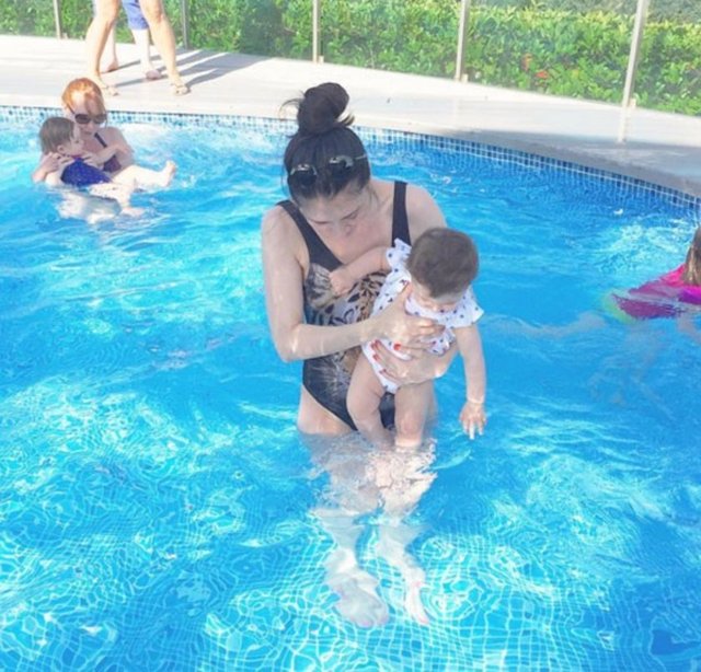 NEFİSE KARATAYYüzme öncesi suya ilk dokunuş şimdilik sadece ayaklarını sokuyoruz havuza, heyecanla denize girmeyi bekliyoruz....