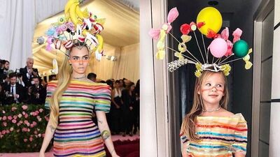 Kırmızı halı ünlülerini taklit eden küçük kız