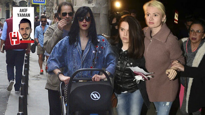 Eşinin arkasına saklandı