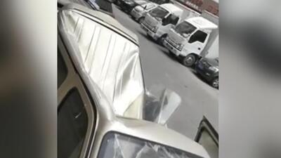 Çinli genç 8 katlı binadan minibüsün üzerine düştü!