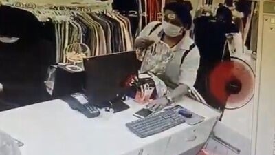 Cep telefonu çalan kadın hırsız kamerada