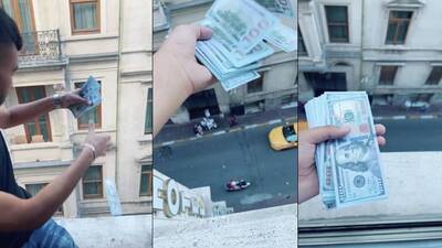 Otel penceresinden para saçtı!