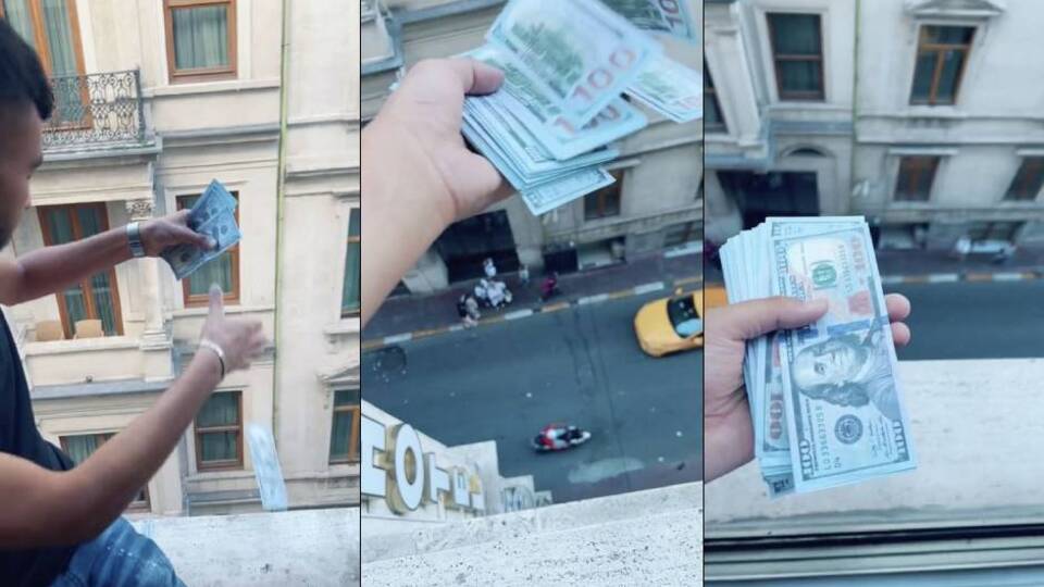 Otel penceresinden para saçtı!