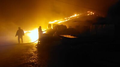 Depoda çıkan yangın gecekonduya sıçradı