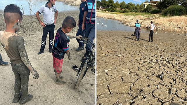 Balçığa saplanan çocukları itfaiye kurtardı