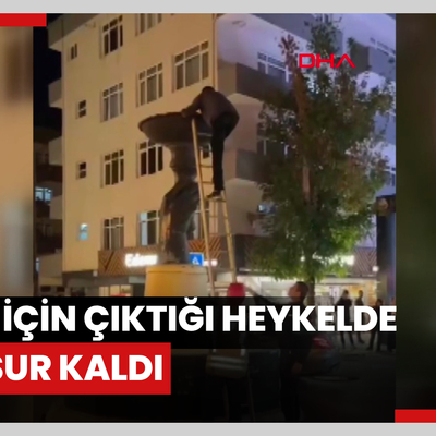 İddia için çıktığı heykelde mahsur kaldı