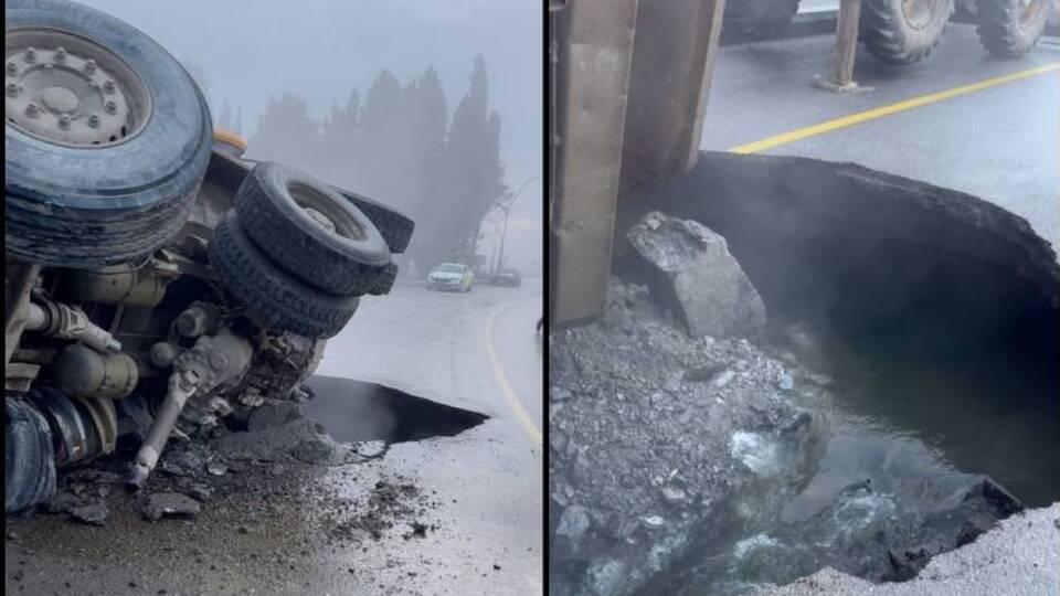 Hafriyat kamyonu yolda oluşan çukura düştü