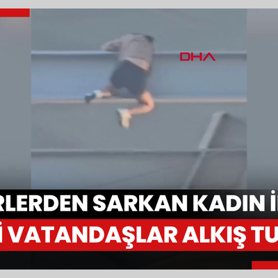 Haliç Metro Köprüsü'nün altındaki demirlerden sarkan kadın ikna edildi; vatandaşlar alkış tuttu