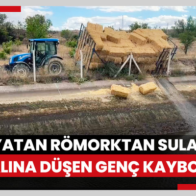 Yan yatan saman yüklü römorktan sulama kanalına düşen genç kayboldu