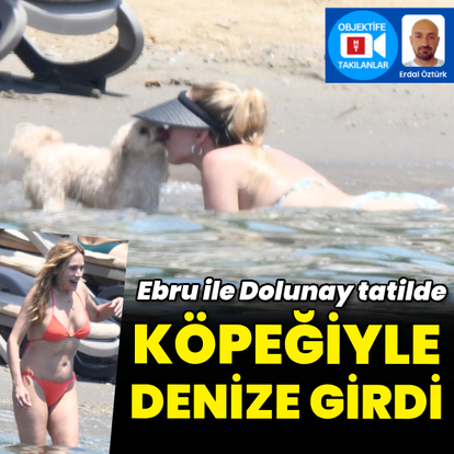 Denize köpeğiyle girdi