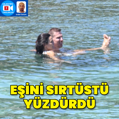 Eşini sırtüstü yüzdürdü