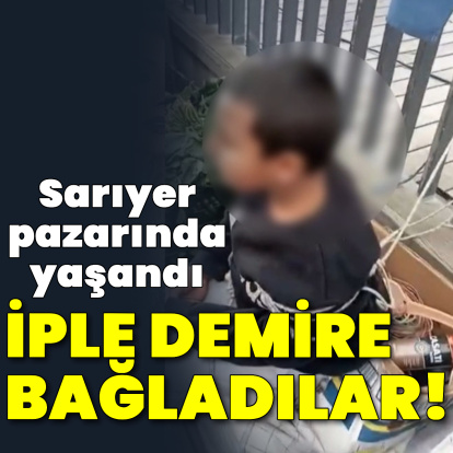 Pazarda eşofman çalan çocuğu iple bağladı