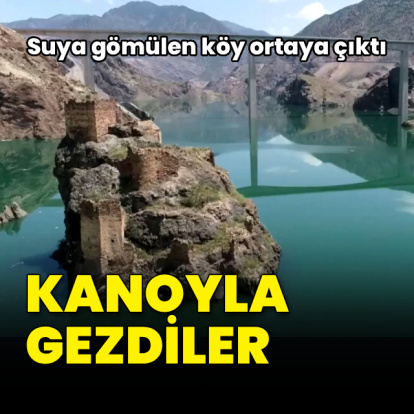Suya gömülen köy ortaya çıktı! Kanoyla gezdiler