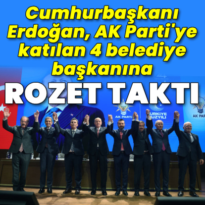 AK Parti'ye katılan 4 belediye başkanına rozet taktı
