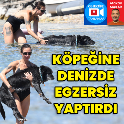 Köpeğine denizde egzersiz yaptırdı