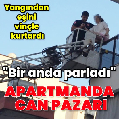 Yangında eşini vinçle kurtardı