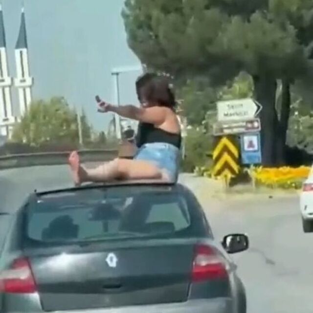 Kaputun üstüne çıkan kadın ve sürücüye gözaltı