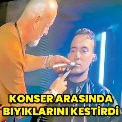Konser arasında bıyıklarını kestirdi
