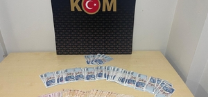 Söke'de sahte parayla alışveriş yaptıkları iddiasıyla gözaltına alınan 2 şüpheliden 1'i tutuklandı