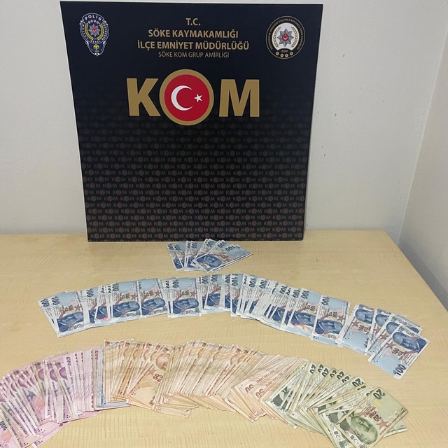 Söke'de sahte parayla alışveriş yaptıkları iddiasıyla gözaltına alınan 2 şü...