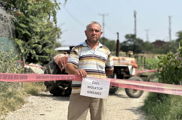 Tapulu arazisindeki yola 'özel mülk' yazısı asıp, ulaşıma kapattı