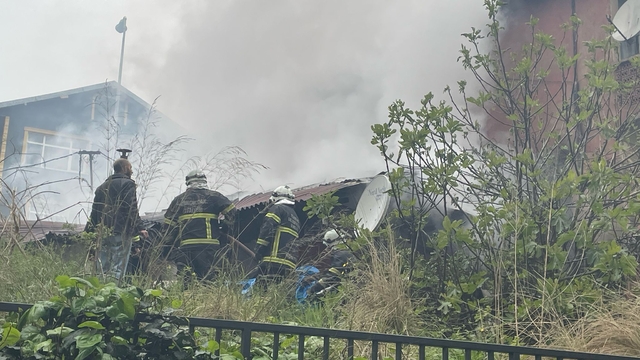 Yangında mahsur kalan görme engelliyi otopark görevlisi kurtardı