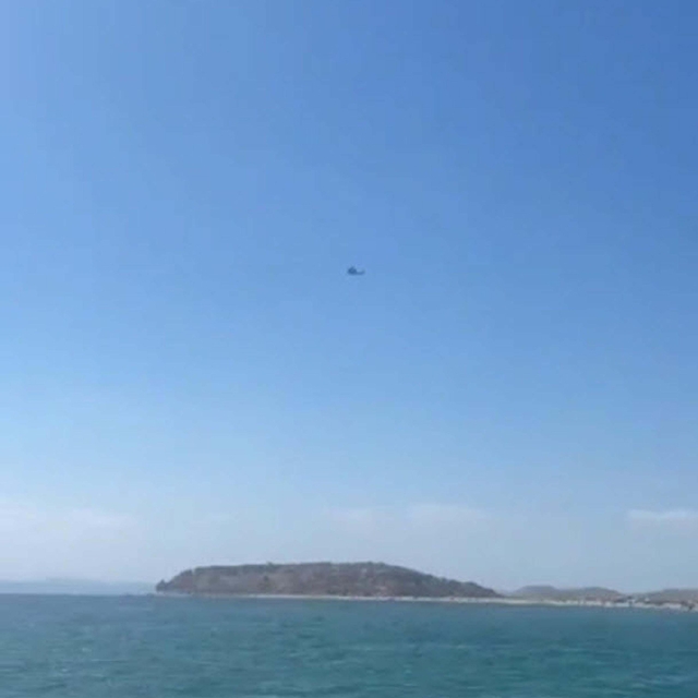 Sahil Güvenlik botuna çarpan göçmen botundaki kayıp kişinin cesedi bulundu;...