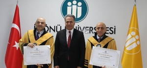 Unvanda yükselen akademisyenlere cübbeleri giydirildi