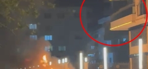 Alev alan otomobile, balkondan hortumla su döktü; o anlar kamerada