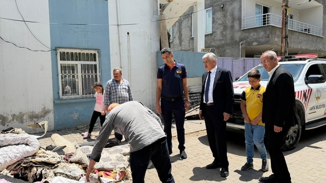 Başkan Hallaç, yangın mağduru aileyi yalnız bırakmadı