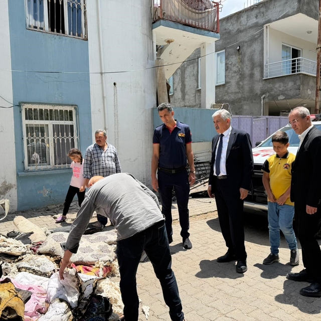 Başkan Hallaç, yangın mağduru aileyi yalnız bırakmadı