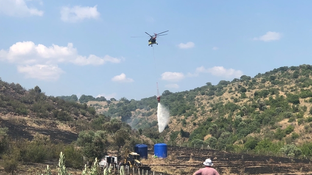 Makilik alanda başlayan yangın büyümeden söndürüldü