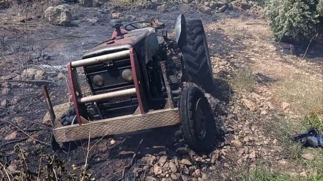 Erzin'de otluk alanda çıkan yangında alevler traktöre sıçradı